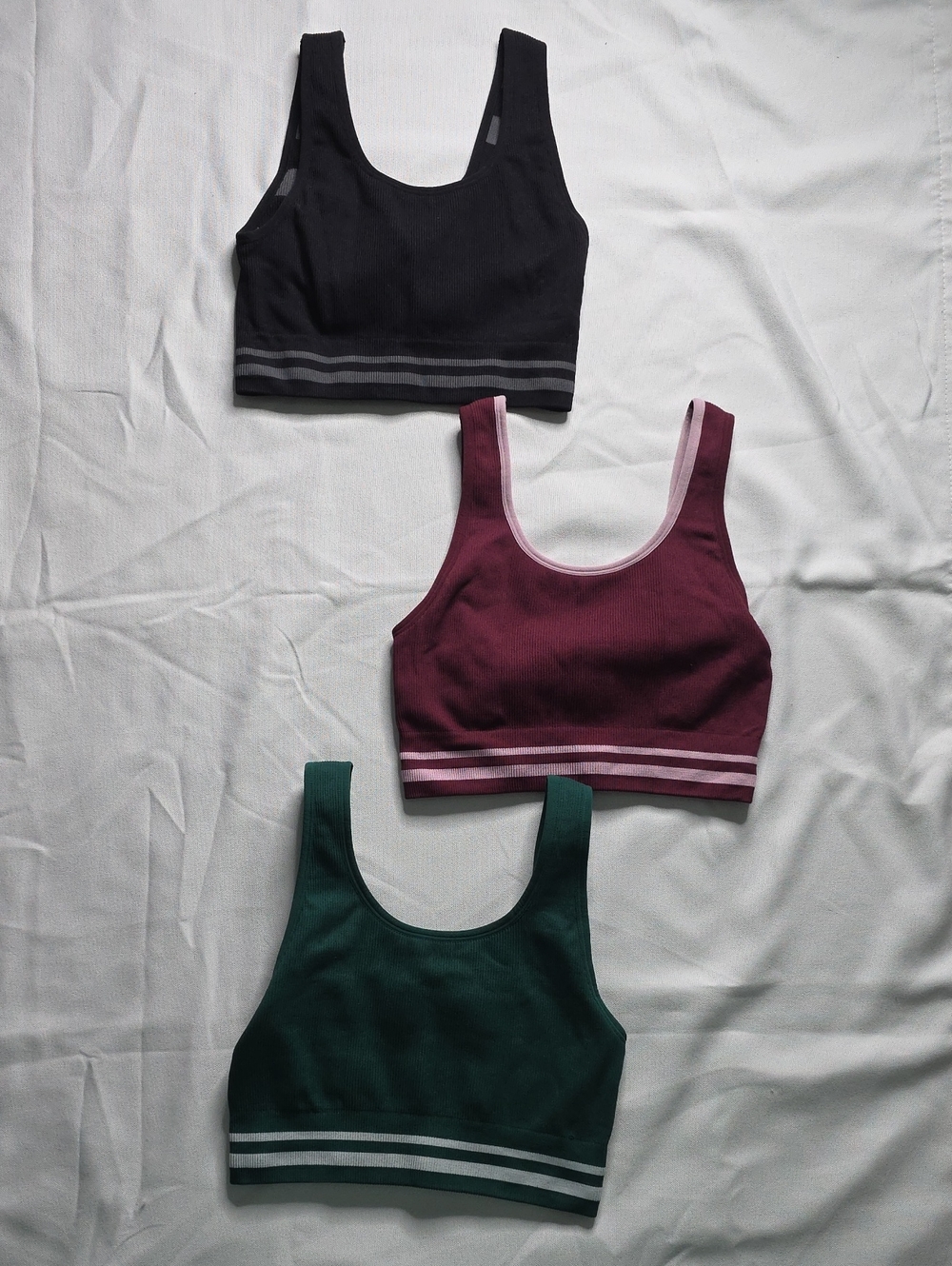 Three Reversible Penn Sports Bras in Black, Burgundy & Deep Green